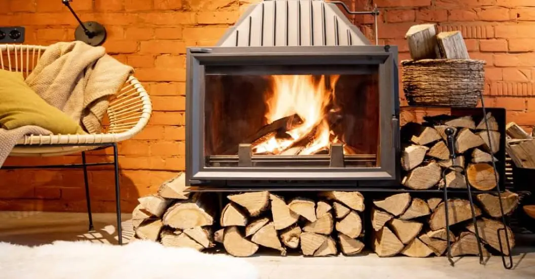 Lit fireplace in cosy living room