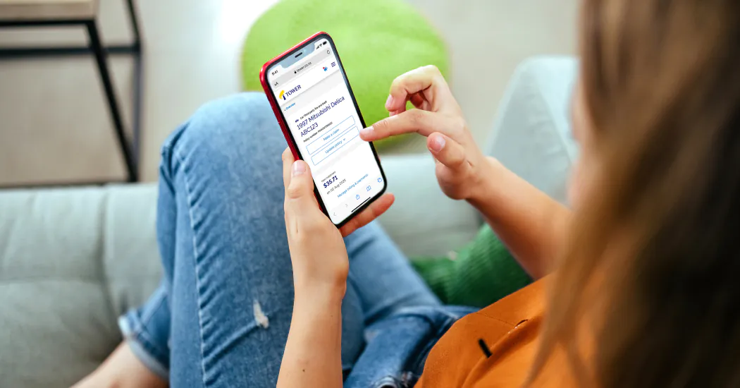 woman reviews insurance checklist on smartphone
