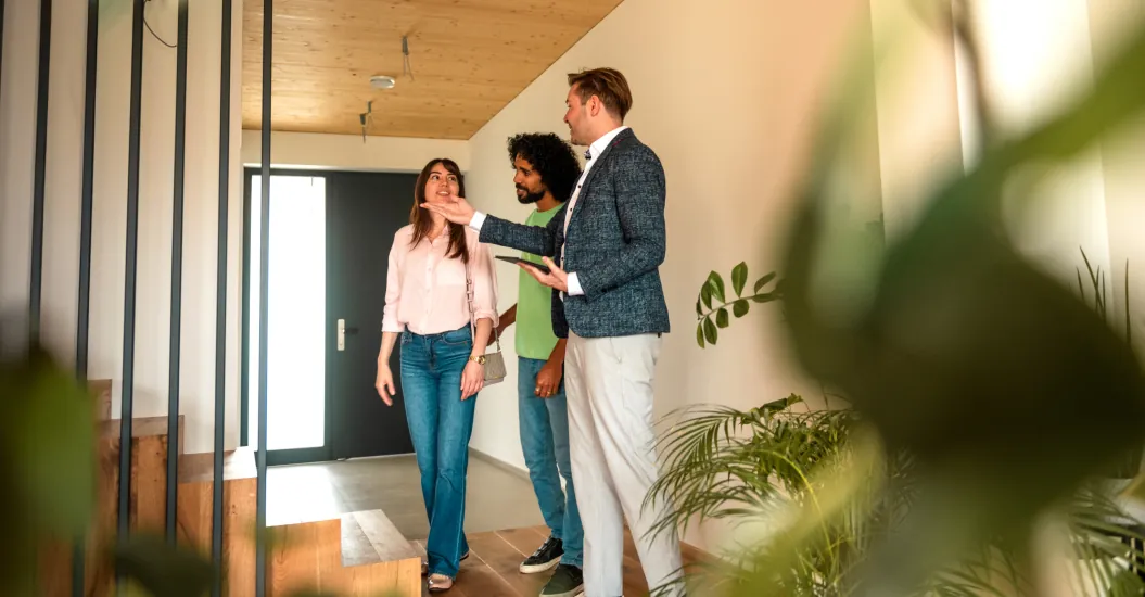 Landlord showing modern rental property to prospective tenants